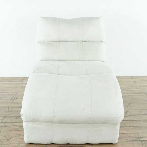 1. Front view of an unused Ashley Furniture chaise lounge sofa with cream upholstery on a wooden floor.