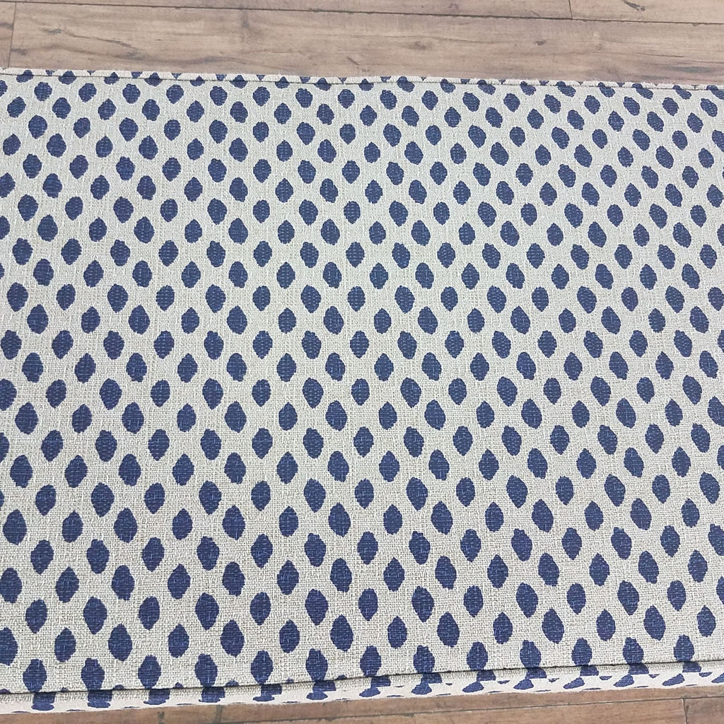 3. Top view of Ballard Designs Moroccan-inspired chair, highlighting the intricate blue dotted pattern on padded frame.