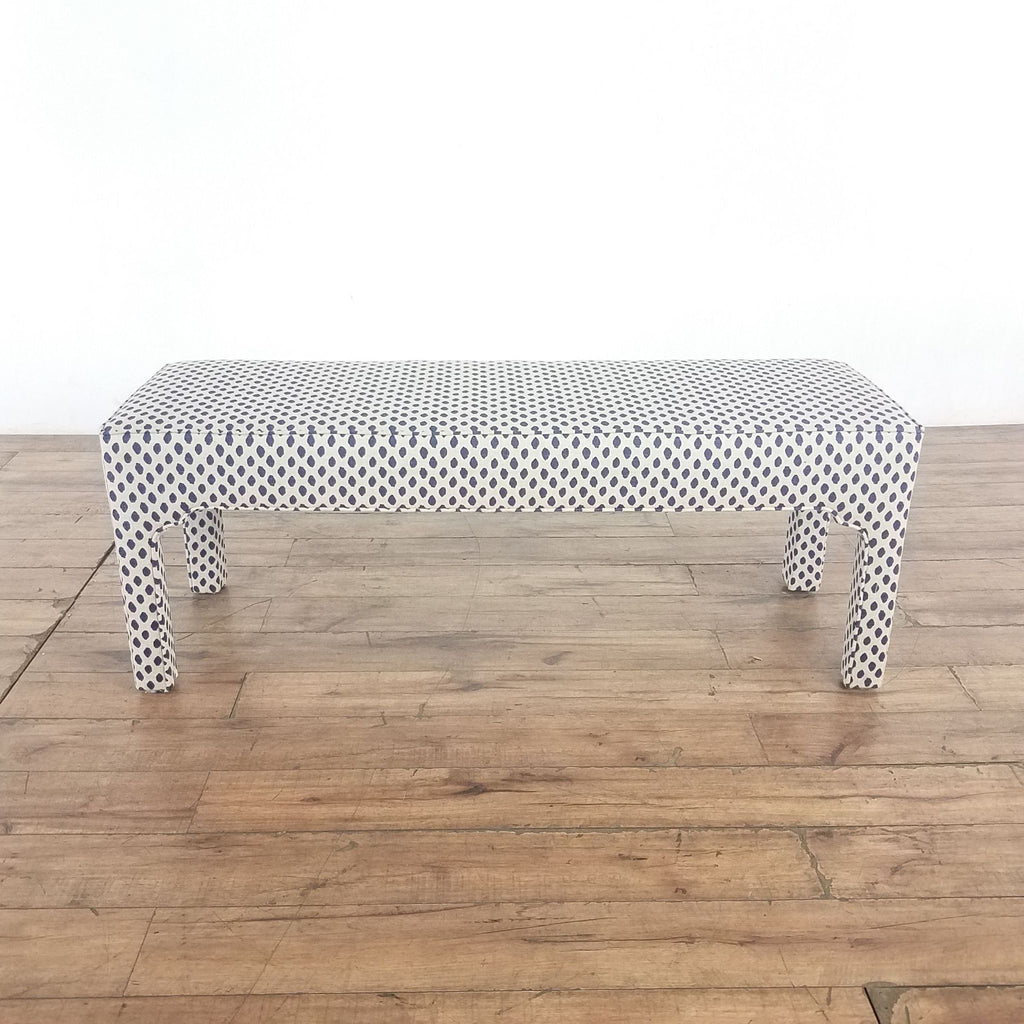 1. Padded hardwood bench by Ballard Designs with Moroccan arch details and blue dotted fabric, categorized as a chair.
