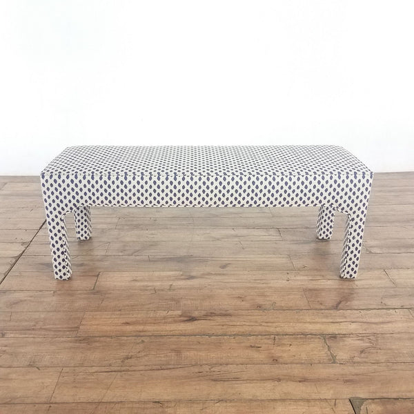 1. Padded hardwood bench by Ballard Designs with Moroccan arch details and blue dotted fabric, categorized as a chair.