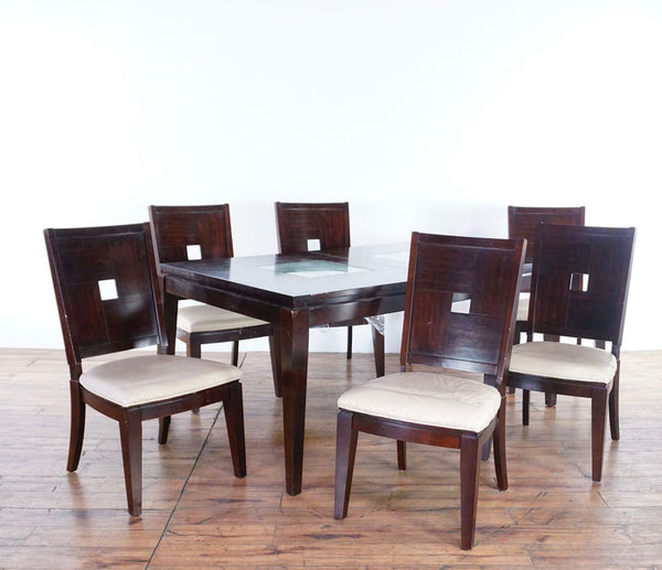 1. Reperch dining set with expandable table featuring crackle glass inserts and six matching chairs.