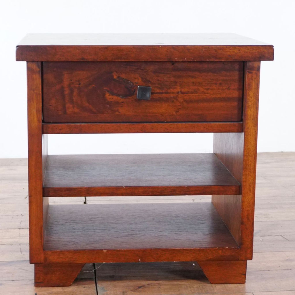 2. Single Reperch end table in brown wood, features a top drawer and two lower shelves, seen from the front.