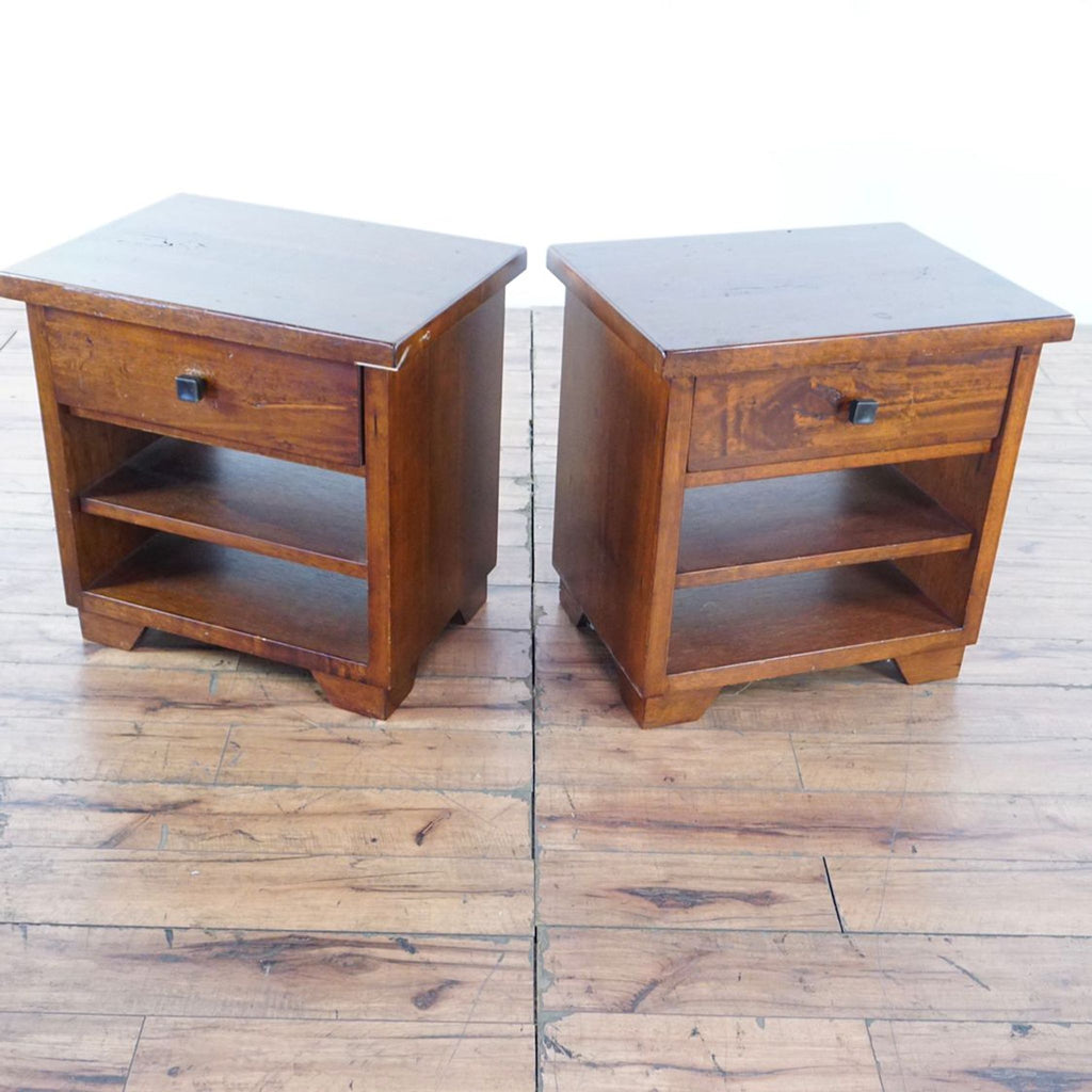 1. Pair of Reperch wooden end tables, each with one drawer and two open shelves, shown on wood flooring.