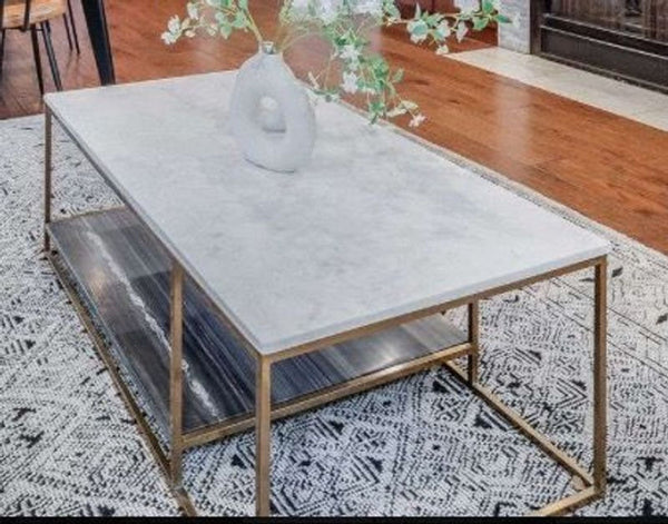 a marble coffee table with a white marble top.