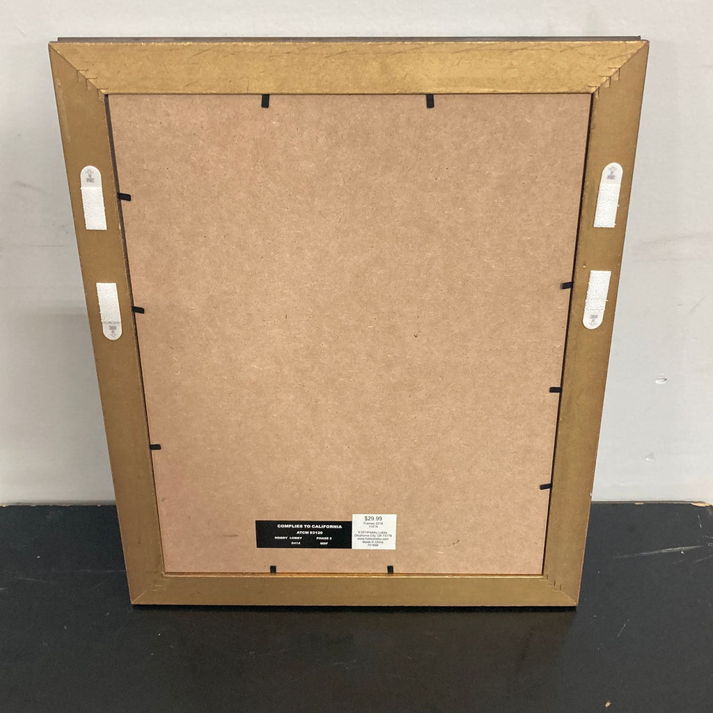 3. Back of a Reperch framed drawing, showing brown frame, hanging hardware, and attached retail label.