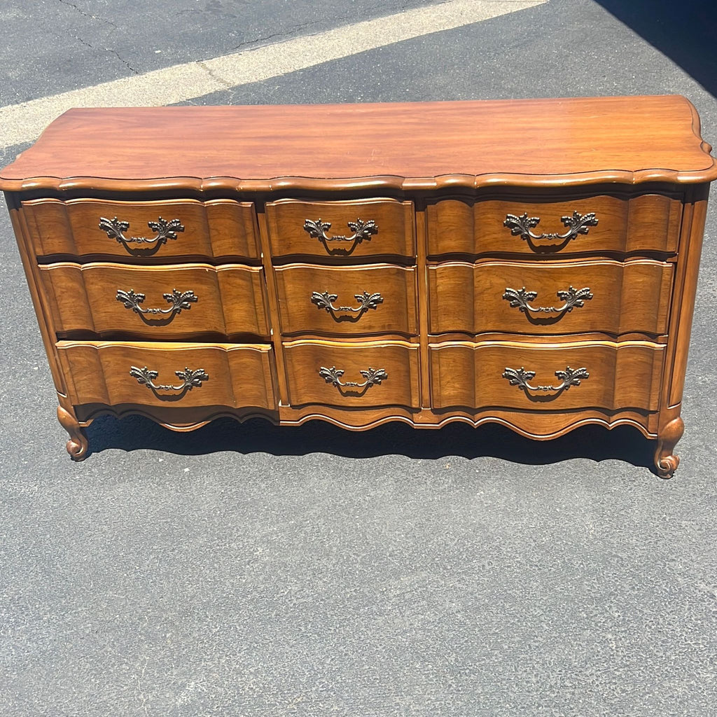 a wooden cabinet with a wooden head board 