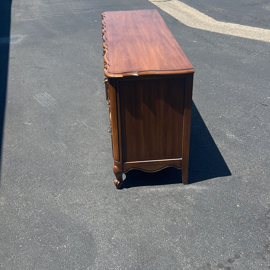 a wooden table with a wooden bench on it 