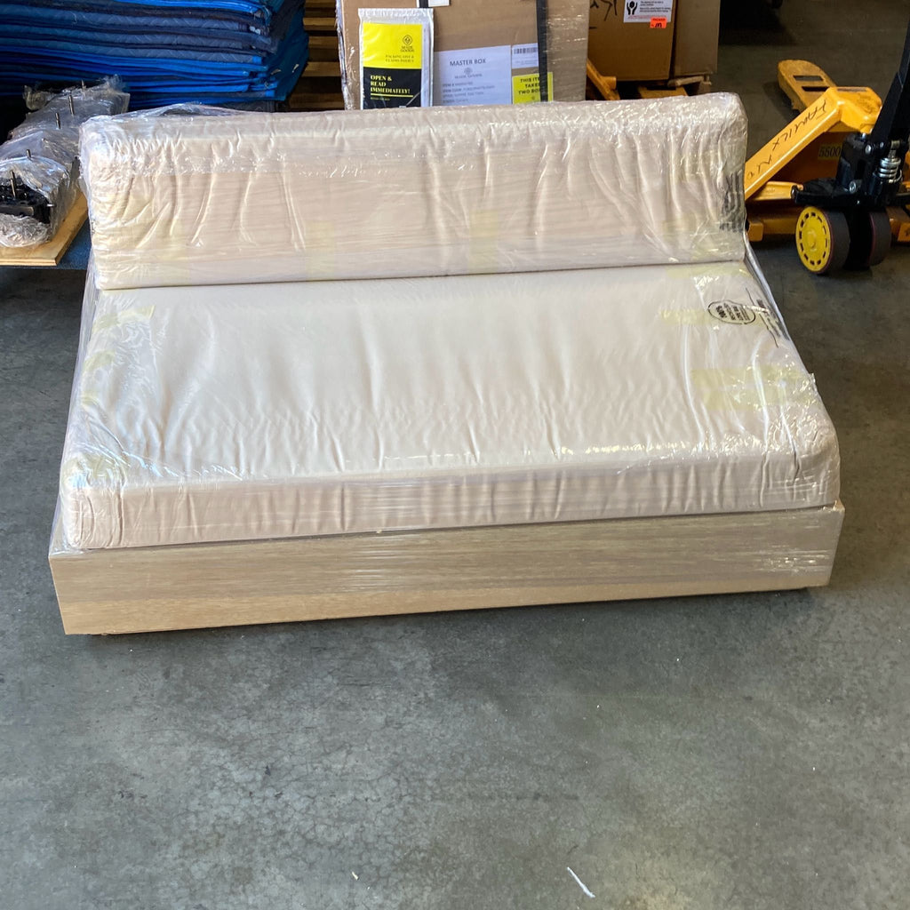 a bed with a white blanket and a black and white bedspread 