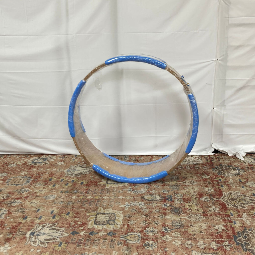 a large, circular, metal ring with a blue rim.
