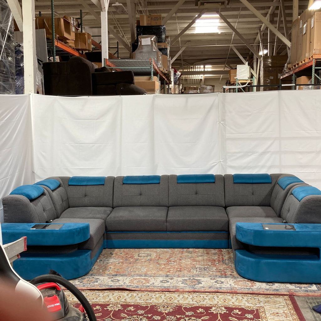 the couches are in a warehouse.