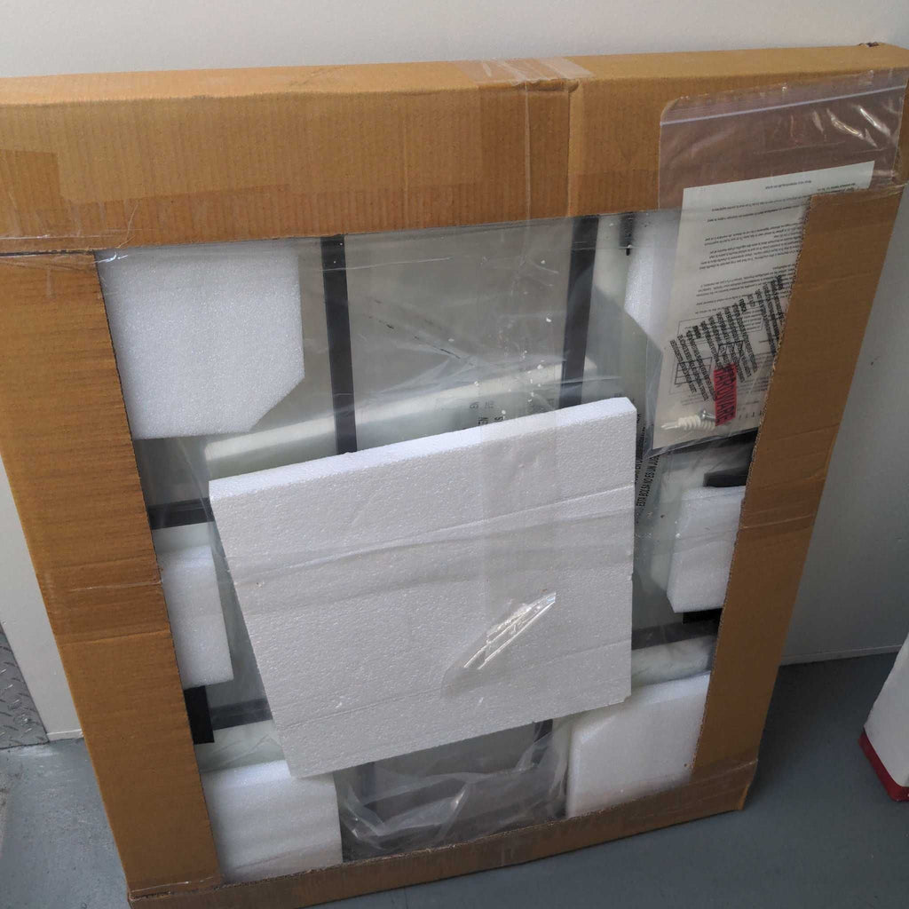 the box with the toilet seat and towel rack