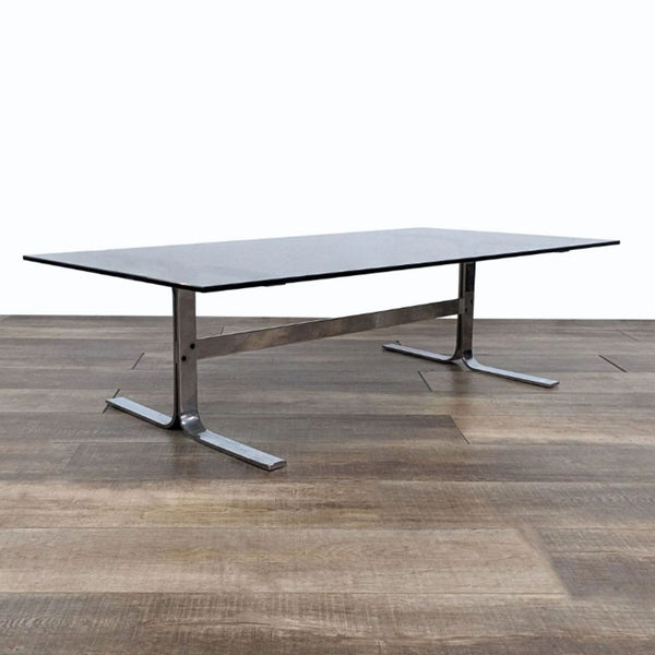 a large rectangular table with a black top and a metal base.