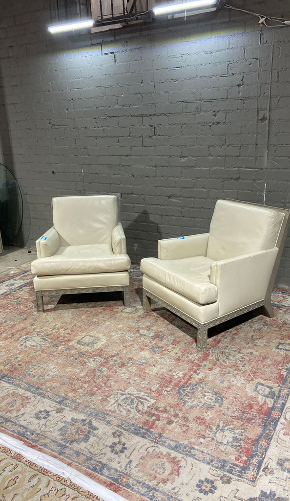 a pair of leather club chairs