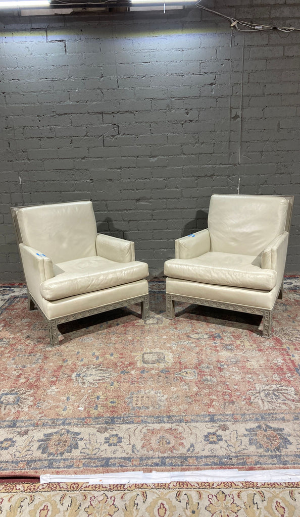 a pair of [ unused0 ] leather club chairs