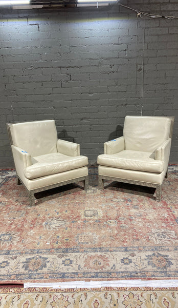 a pair of [ unused0 ] leather club chairs