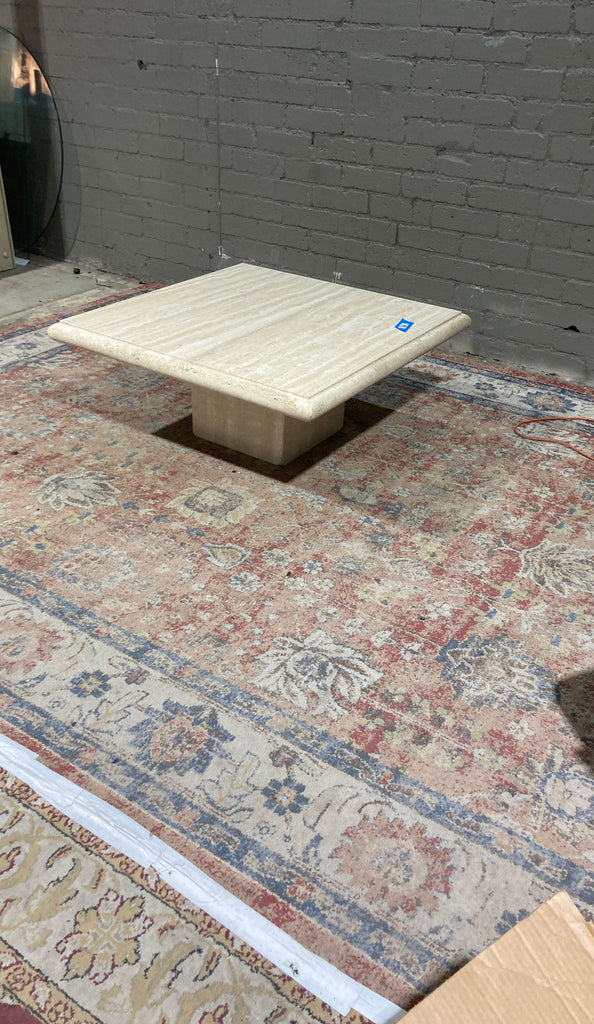 a marble coffee table with a marble top.