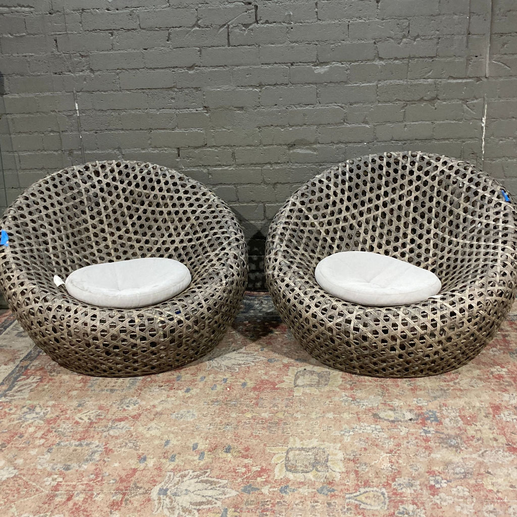 two white toilets sitting next to each other 