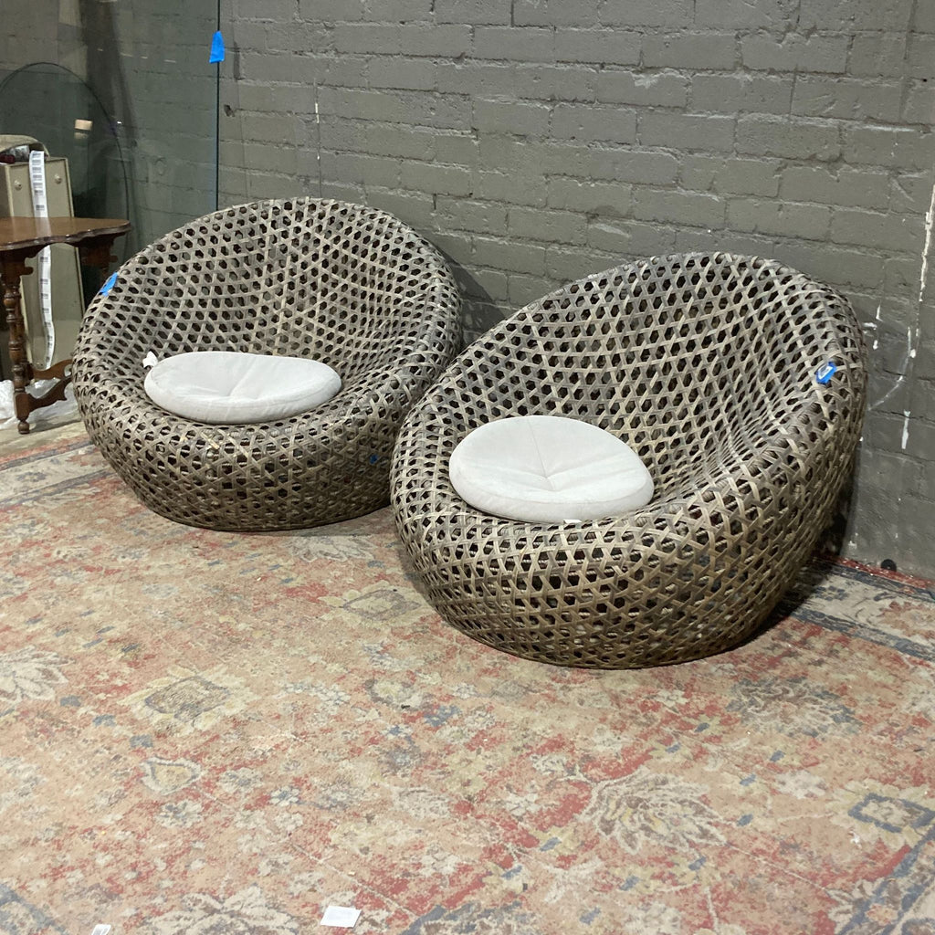 a row of wooden chairs sitting on top of a brick wall 