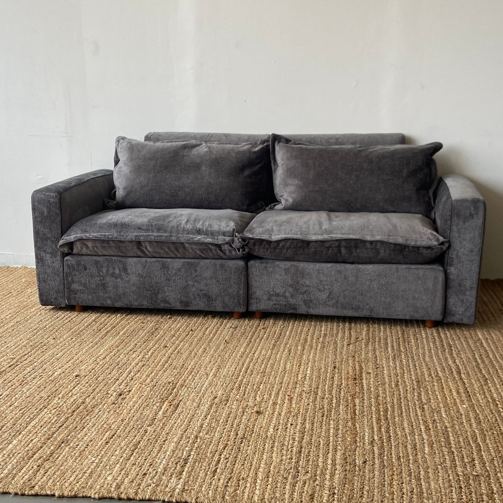 a couch with a black couch cushions and a black couch cushion 