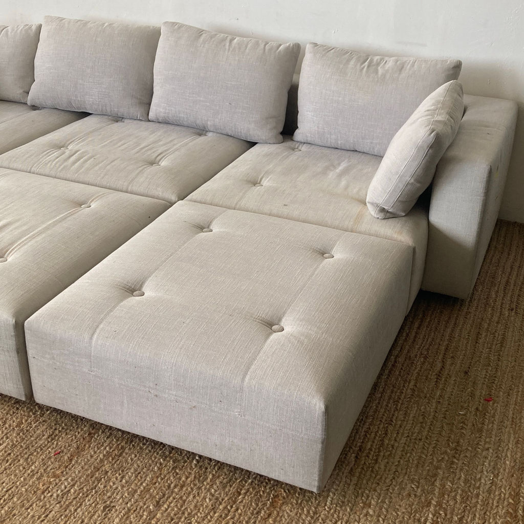 Minnoti Modern Modular Sectional with a Pair of Minotti Ottoman's and accompanying Stone side table