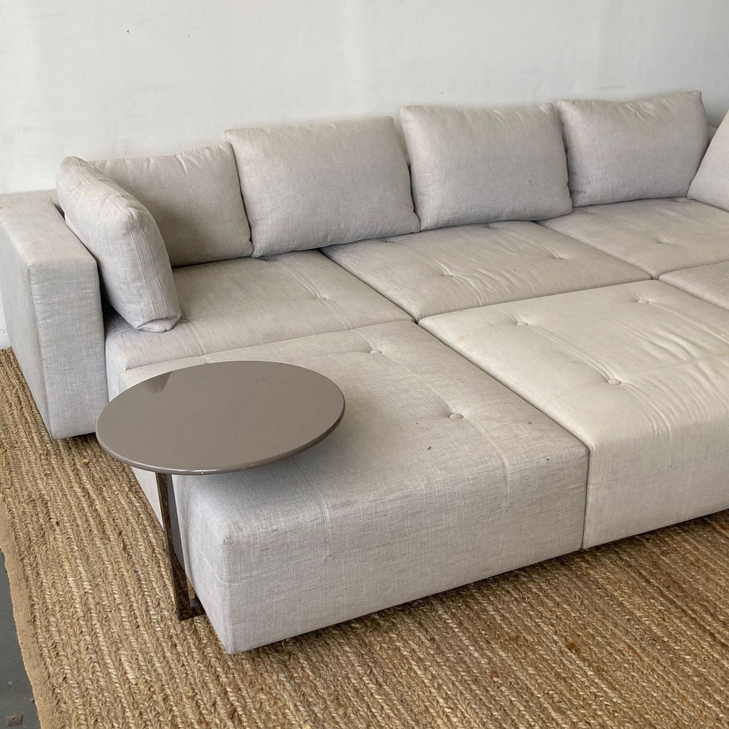 Minnoti Modern Modular Sectional with a Pair of Minotti Ottoman's and accompanying Stone side table