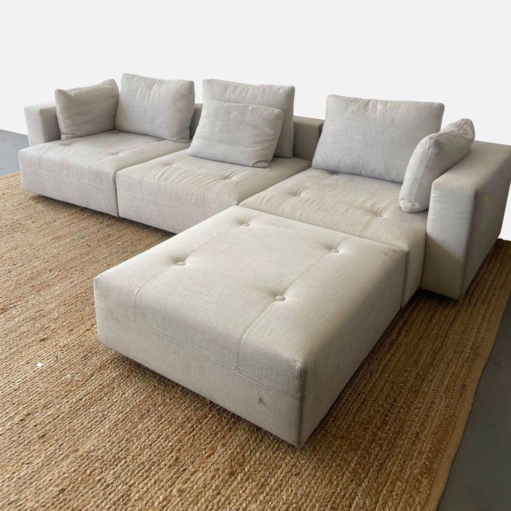 Minnoti Modern Modular Sectional with a Pair of Minotti Ottoman's and accompanying Stone side table