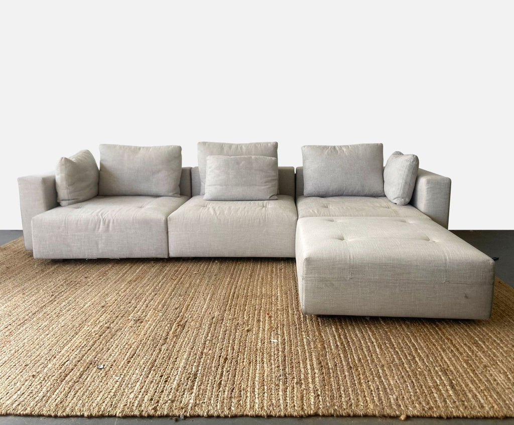 Minnoti Modern Modular Sectional with a Pair of Minotti Ottoman's and accompanying Stone side table