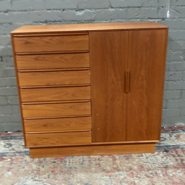 Wooden dresser by Westnofa Furniture against a gray brick wall.