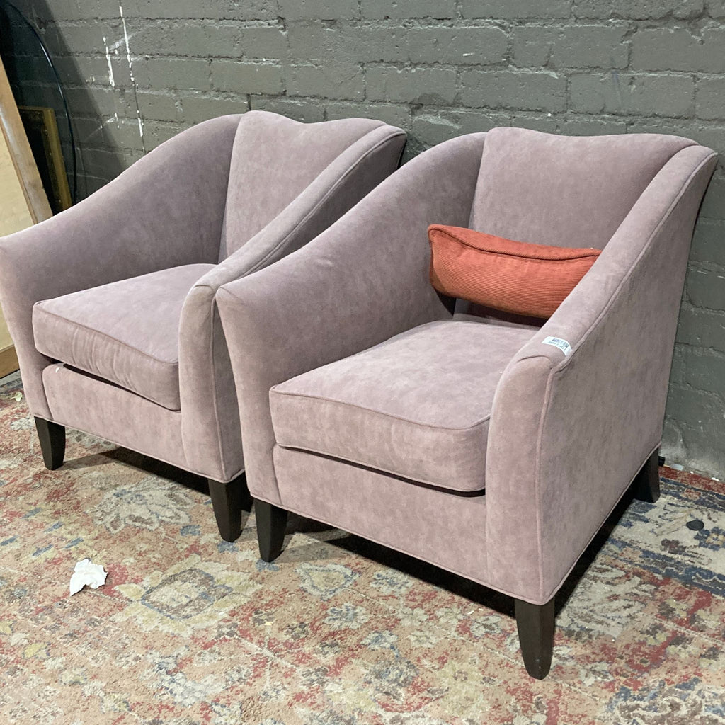Pair of grayish pink lounge chairs by Ethan Allen, featuring curved arms.