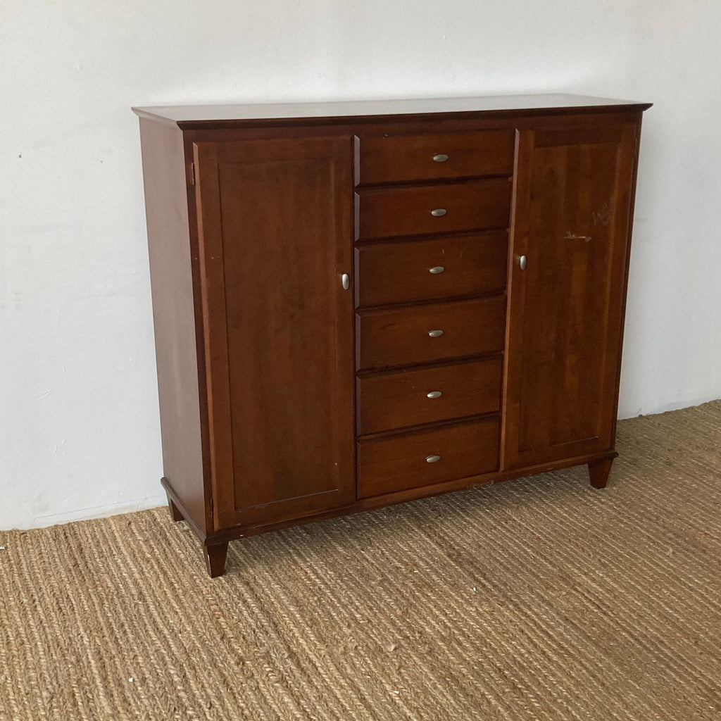 Ethan Allen dresser with six drawers flanked by two door cabinets.