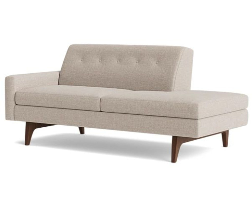 Angled view of a beige 3-seat sofa featuring plush cushions and wooden legs.