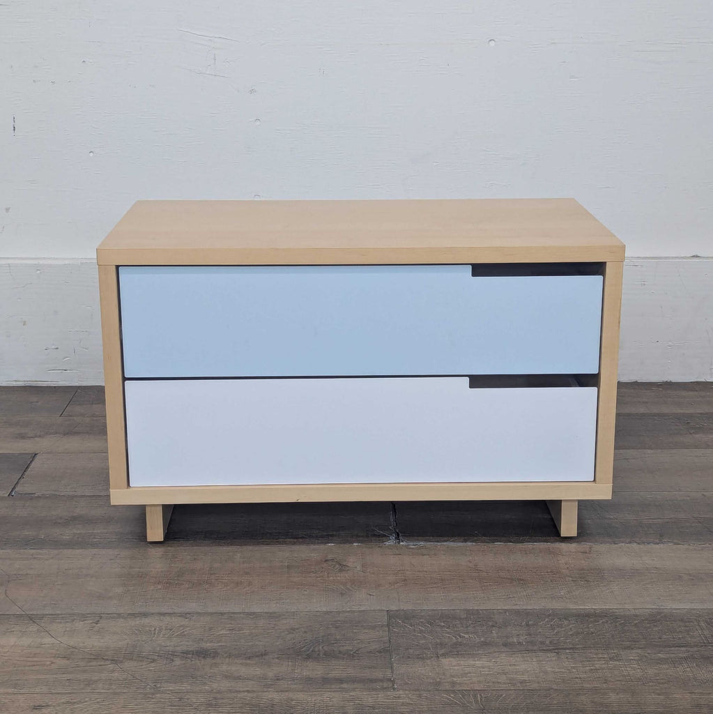 Maple chest with two powder-coated steel drawers in white and ivory, featuring self-closing mechanisms.