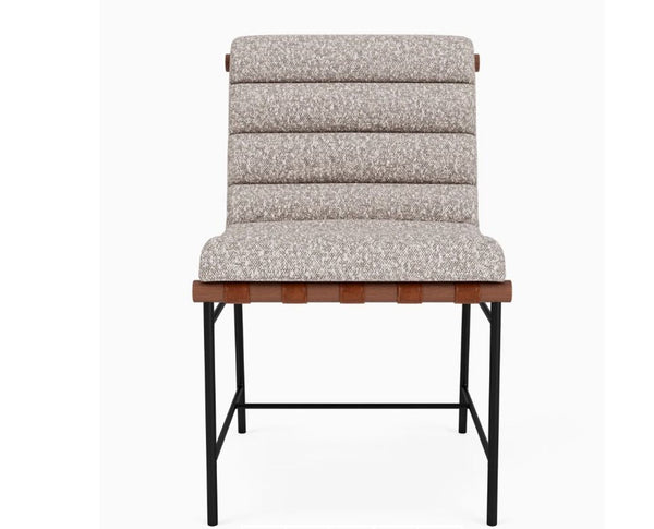 Front view of Vail Dining Chair with stone boucle upholstery and leather straps.