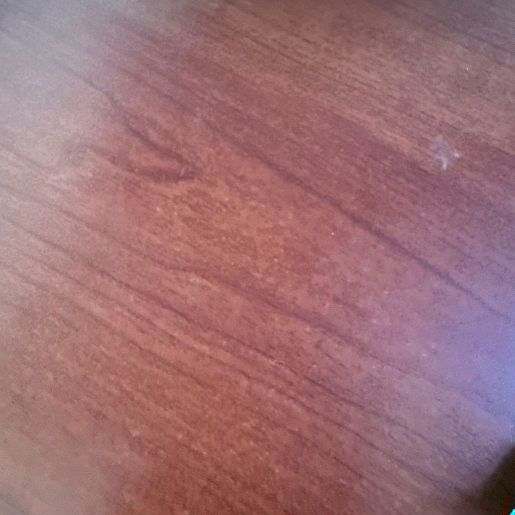 3. Another close-up of the reddish wood surface, highlighting subtle grain and finish quality.