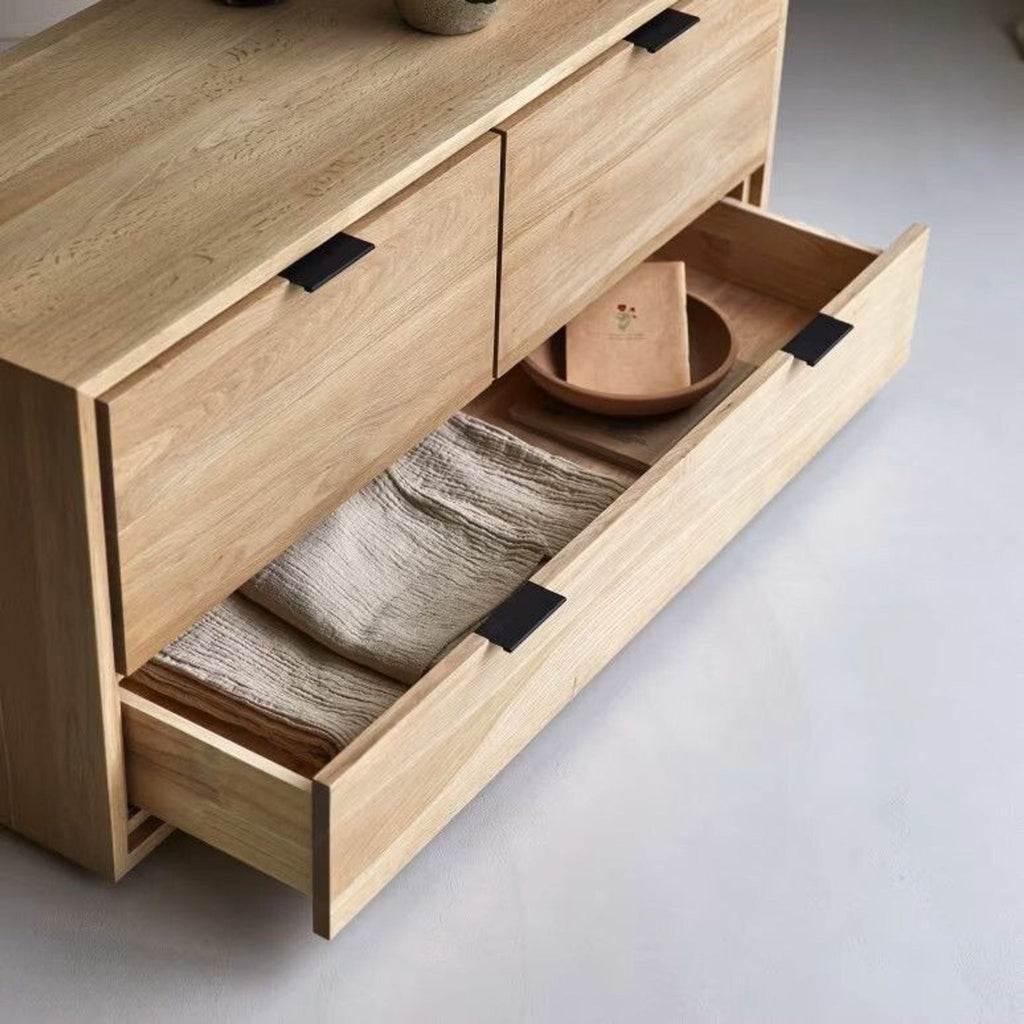 2. Open drawer of Tikamoon oak unit showing ample storage for linens and dishware, suitable as a sideboard.