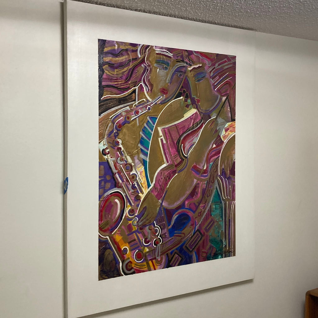 2. Side view of a framed, colorful abstract artwork by Vadik Suljakov depicting musicians, mounted on a pale wall.  