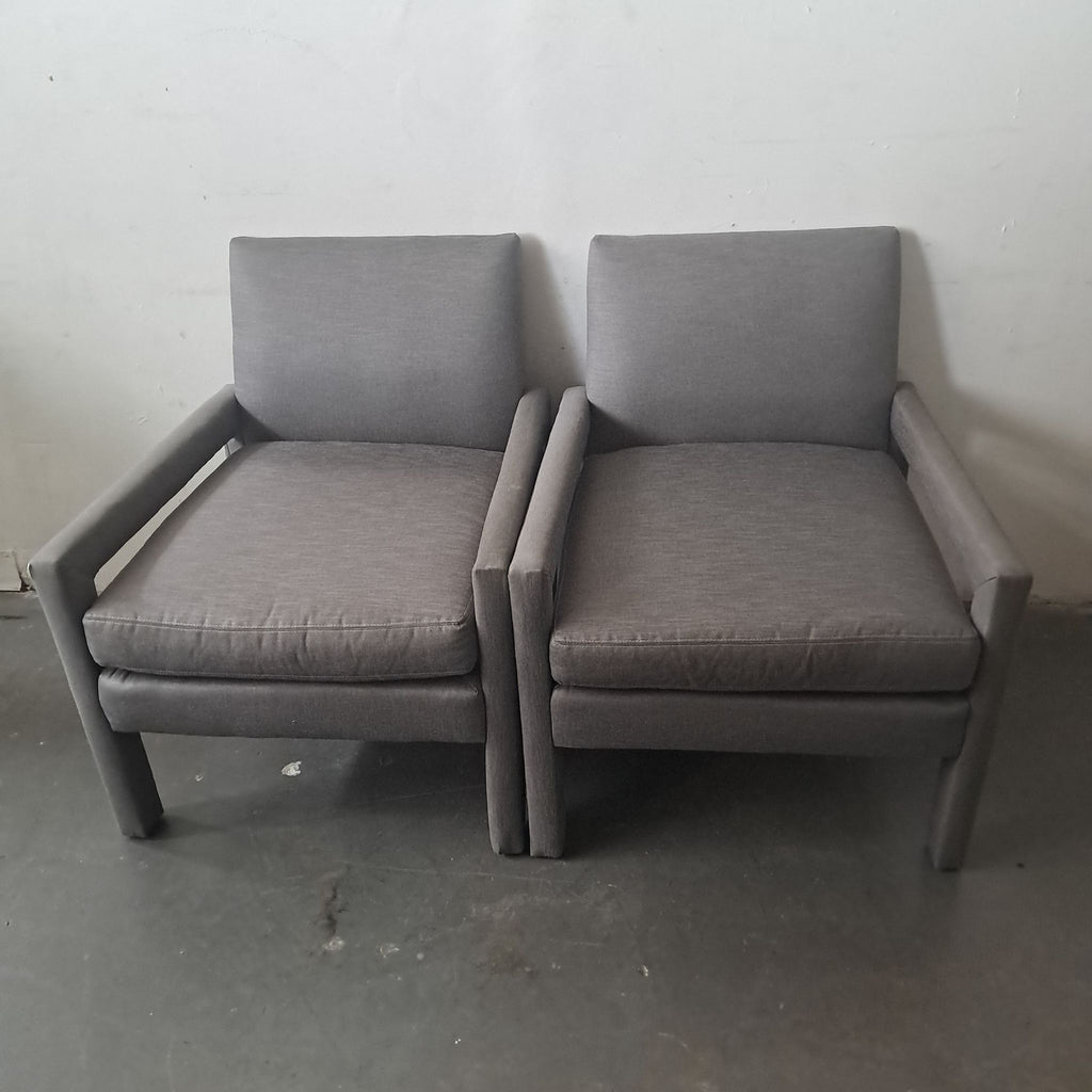 1. Pair of grey lounge chairs from Jayson Home Collection placed side by side against a plain wall.
