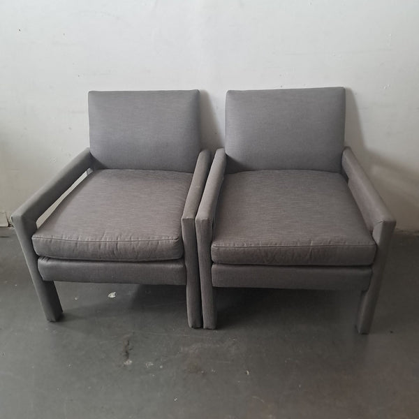 1. Pair of grey lounge chairs from Jayson Home Collection placed side by side against a plain wall.