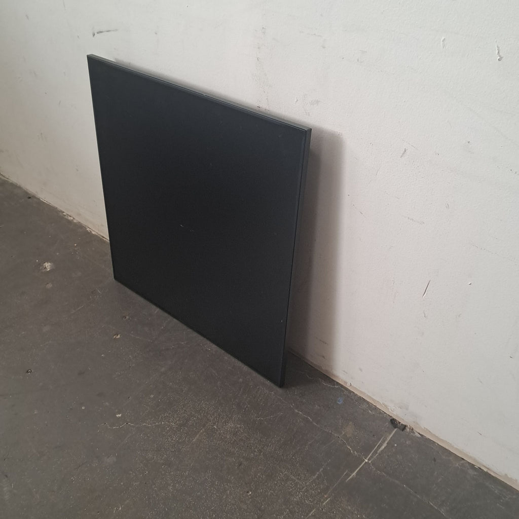 2. Minimalist LAGO Frame Genesis NFT art display in black, leaning on a scuffed floor and white wall.
