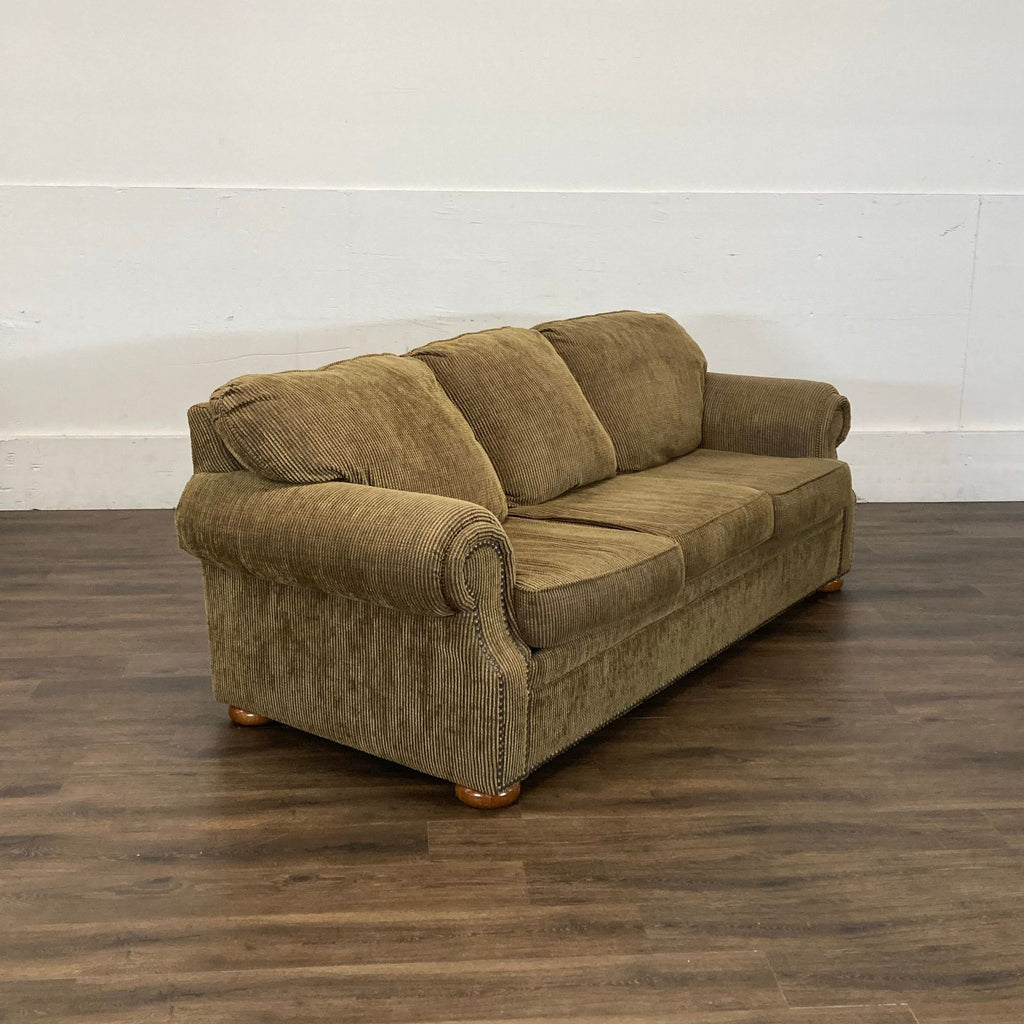 3. Angled view of a brown Reperch 3-seat sofa, showcasing plush cushions and classic rolled-arm design.
