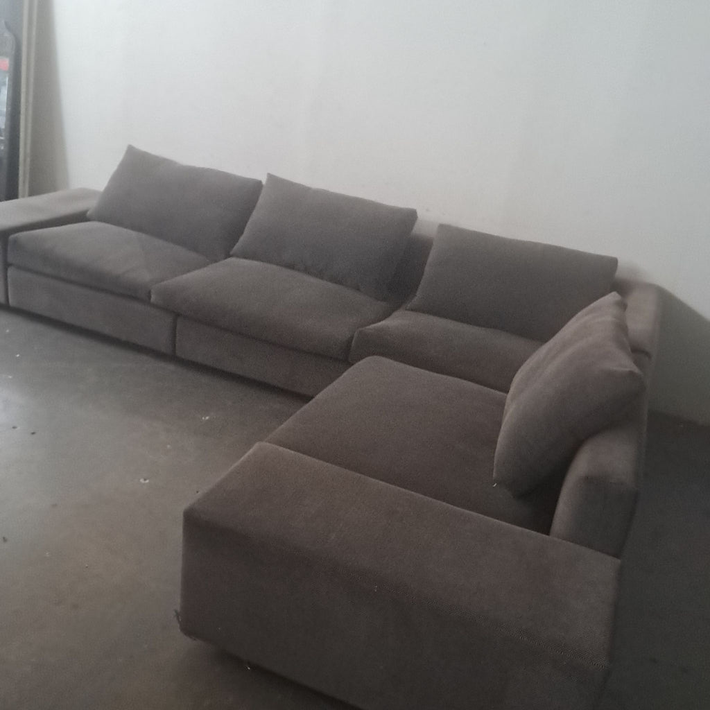 2. Gray fabric Eilersen sectional with generous seating and clean lines, perfect for family or guest lounging.