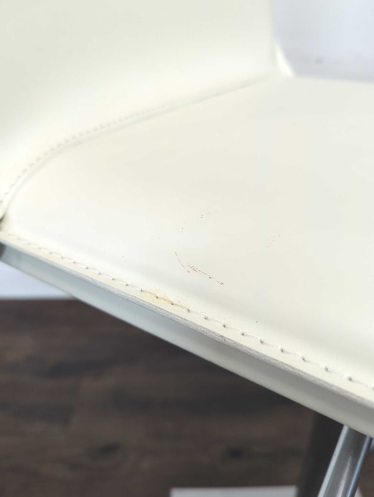 Hand sewn stain-resistant leather. Features a gas piston lift and36 degree swivel. Height adjustable for counters and bars.