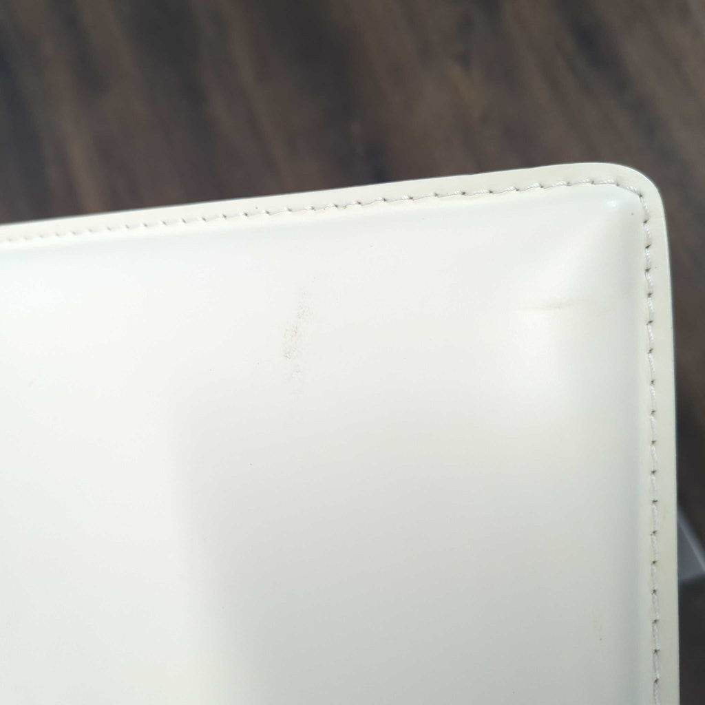 Hand sewn stain-resistant leather. Features a gas piston lift and36 degree swivel. Height adjustable for counters and bars.