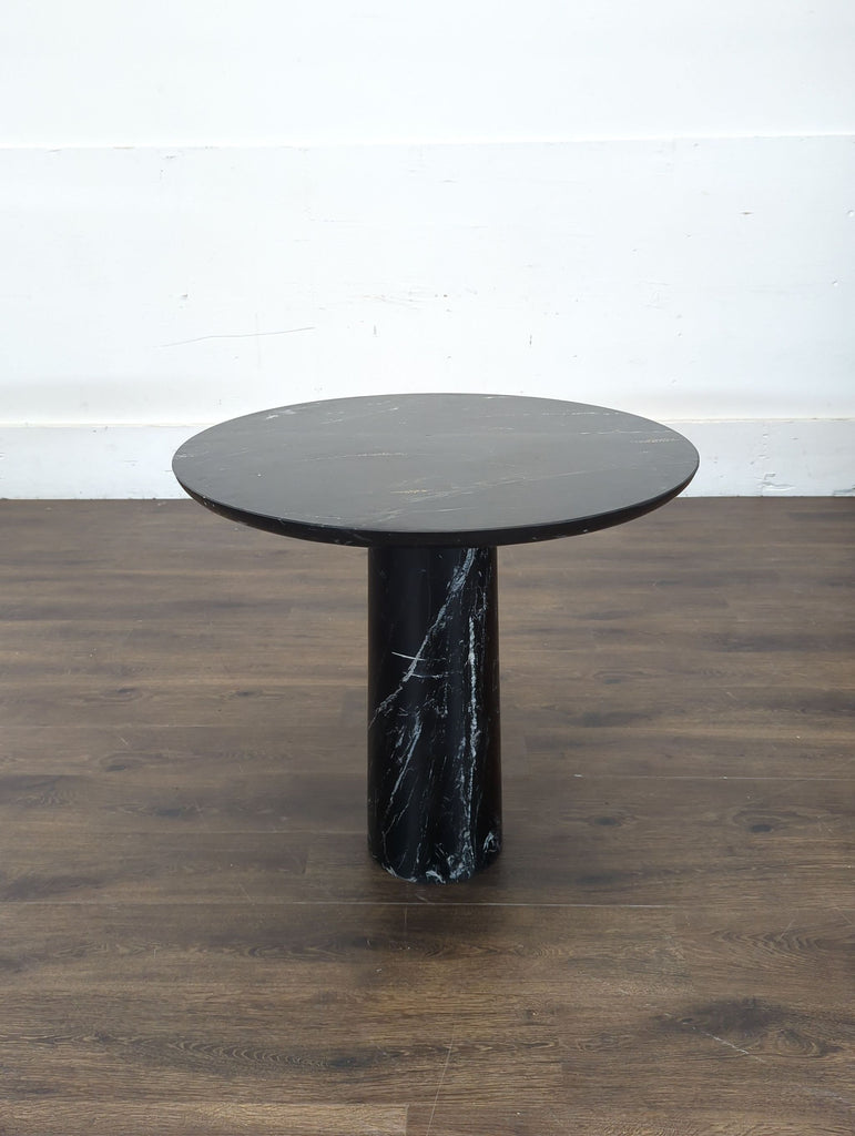 2. Elegant Crate and Barrel dining table showcasing clean lines and natural wood, perfect for contemporary dining spaces.