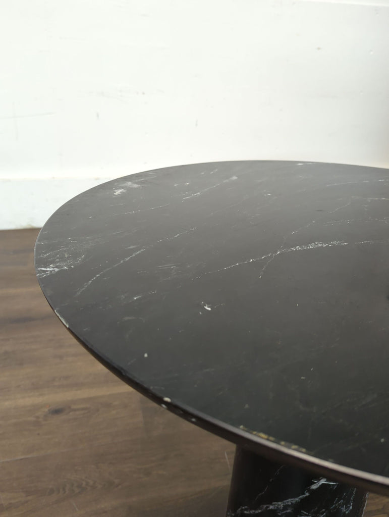 1. Rectangular Crate and Barrel dining table with a smooth wooden top and minimalist legs, set in a modern room.