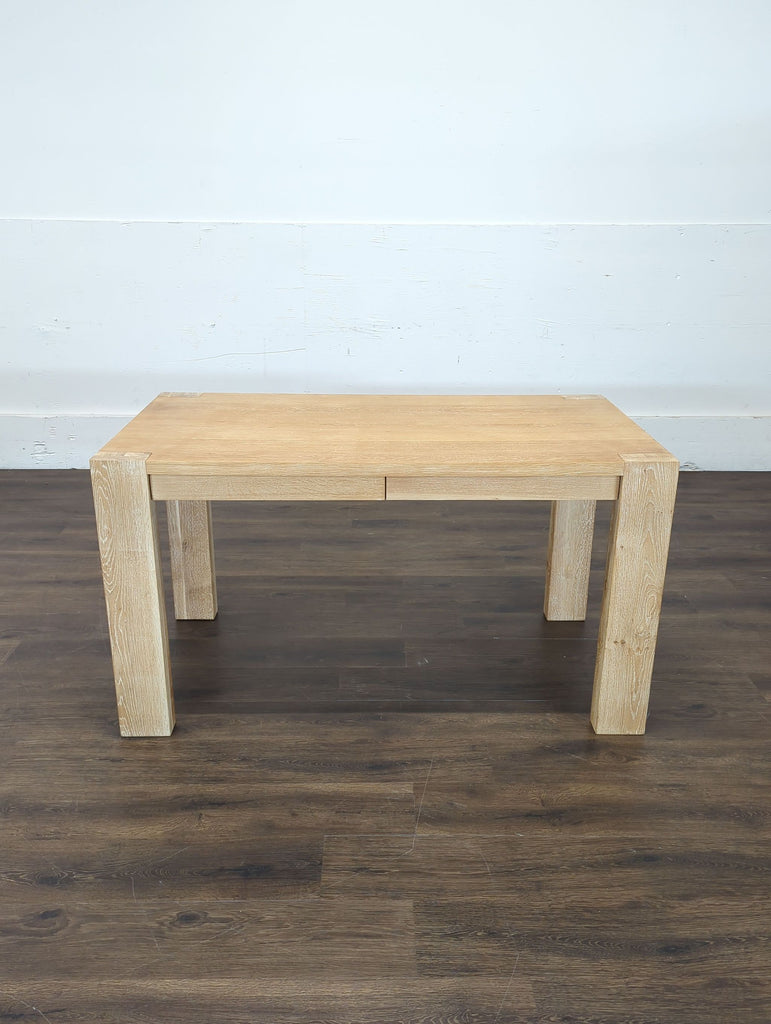 3. Crate and Barrel desk featuring a stylish new lamp, ideal for a minimalist workspace.