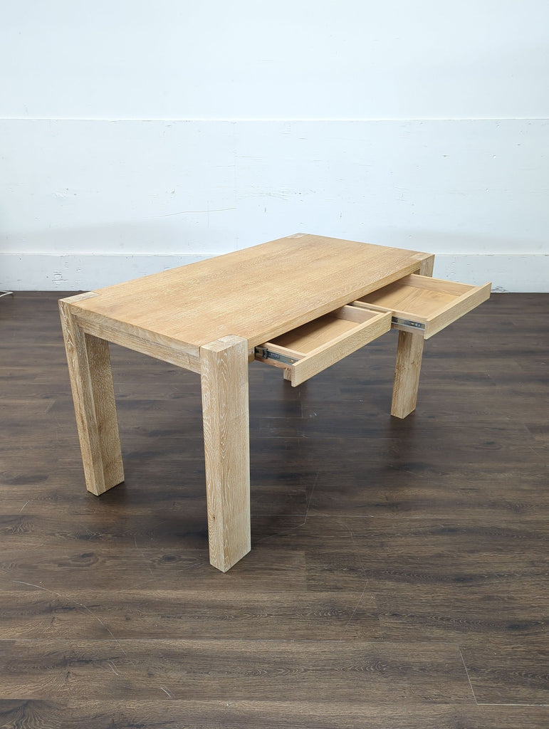 2. Sleek desk from Crate and Barrel paired with a contemporary lamp, perfect for working.  