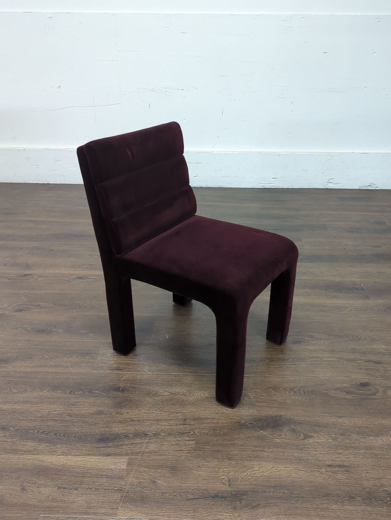 2. Elegant dining chair from Crate and Barrel, featuring clean lines and a cushioned seat for comfort.  