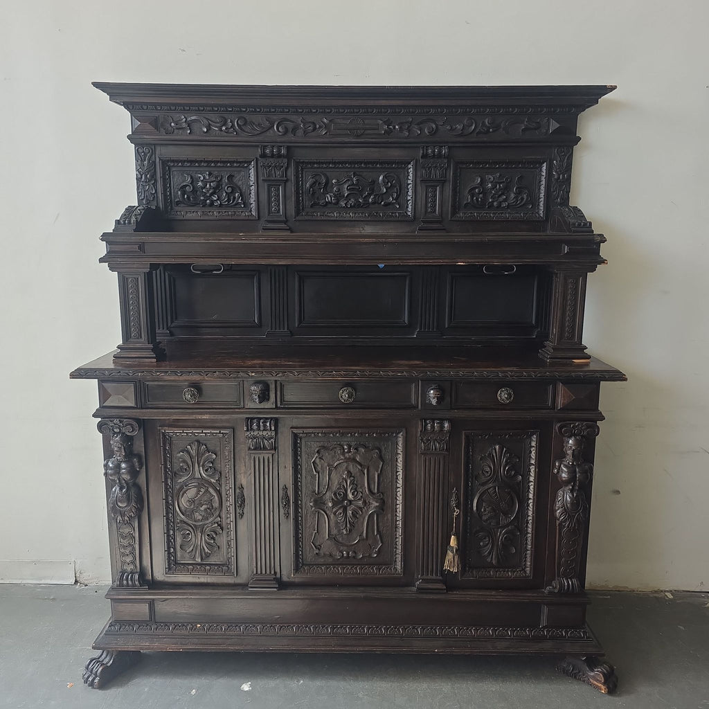 1. Antique dark wood cabinet with ornate hand-carved details, decorative panels, and multiple drawers for storage.