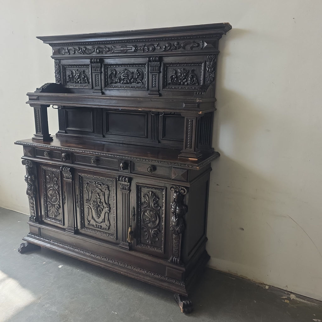 2. Elegant antique cabinet featuring intricate carvings, decorative columns, and ample compartments in rich dark wood.